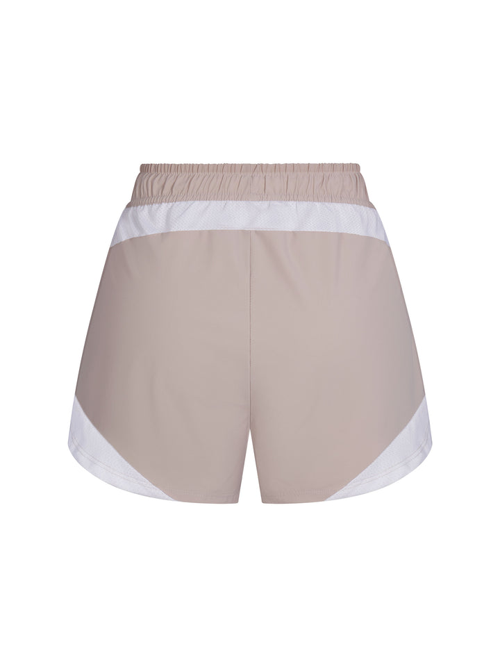 Women's Vented Court Short back view in Clay and White. Small logo centered below waistband