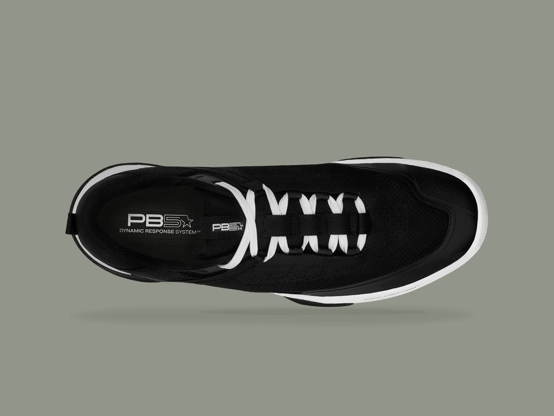 Top view of black and white PB5star Court2 sneaker featuring breathable mesh upper, dynamic response system insole, and sleek design.