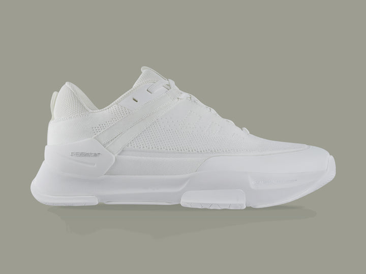 Side view of white PB5star Court2 performance sneaker featuring breathable mesh upper, durable sole with hexagonal grip pattern, and modern design.