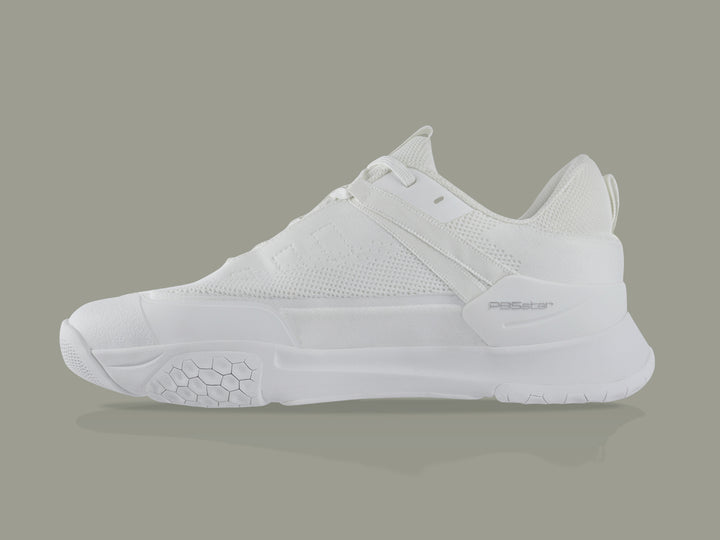 Side view of white PB5star Court2 performance sneaker featuring breathable mesh upper, durable sole with hexagonal grip pattern, and modern design.