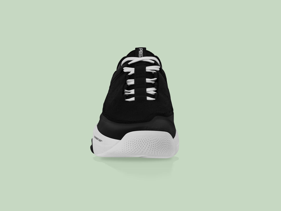 Front view of black and white PB5star Court2 sneaker showcasing a breathable mesh upper, durable toe cap, and modern design.