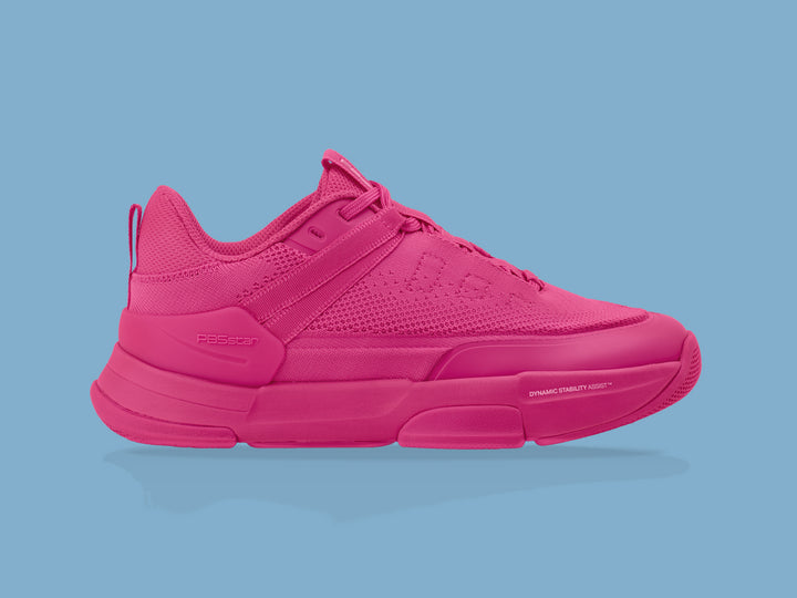 Side view of pink PB5star Court2 performance sneaker featuring breathable mesh upper, durable sole with hexagonal grip pattern, and modern design.