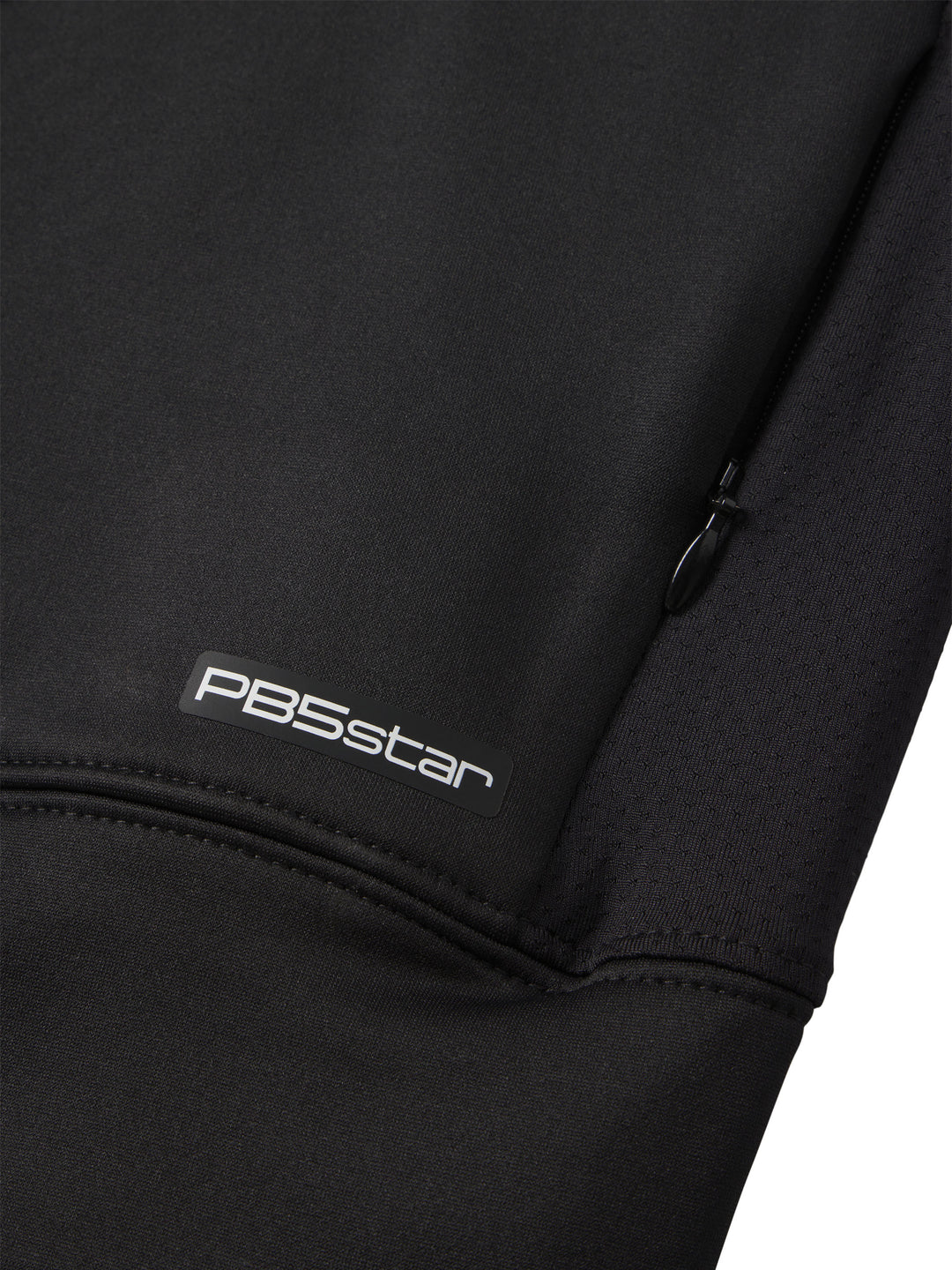 Close-up of PB5Star logo on a black Cropped Performance Hoodie with a focus on the zipper detail and fabric texture.