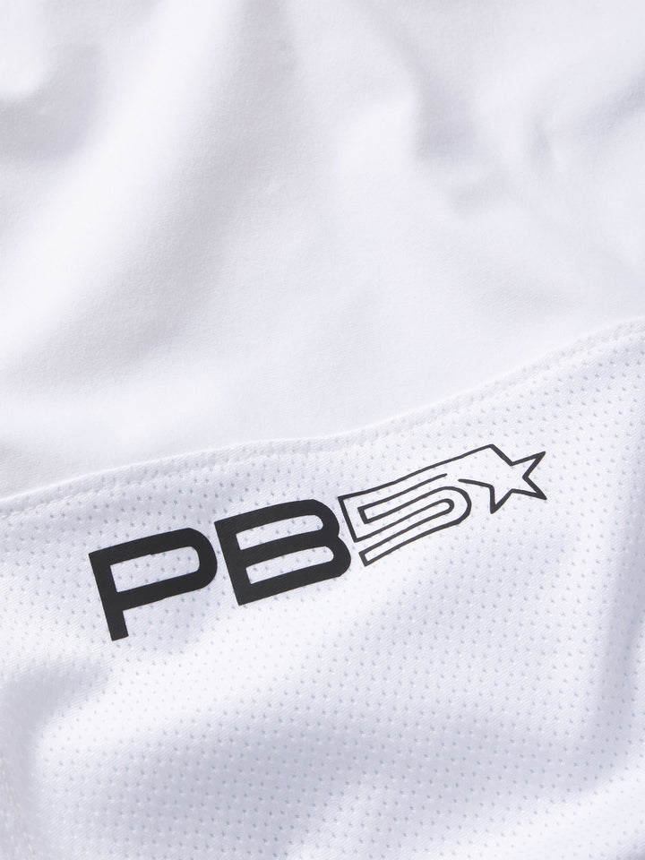 Detail of PB5Star logo on white Mesh Panel Pickleball Skirt, highlighting the breathable fabric and crisp sporty look.