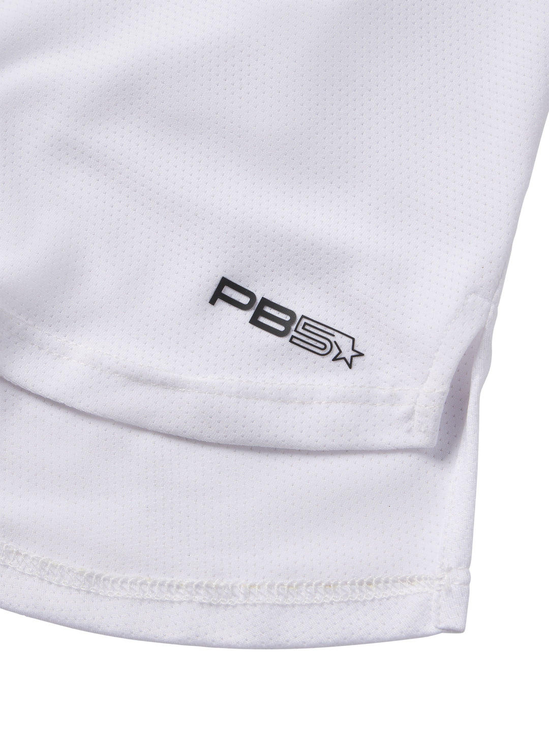 Close-up of the PB5Star logo on a white Cropped Racer Back Tank top highlighting the mesh fabric texture.
