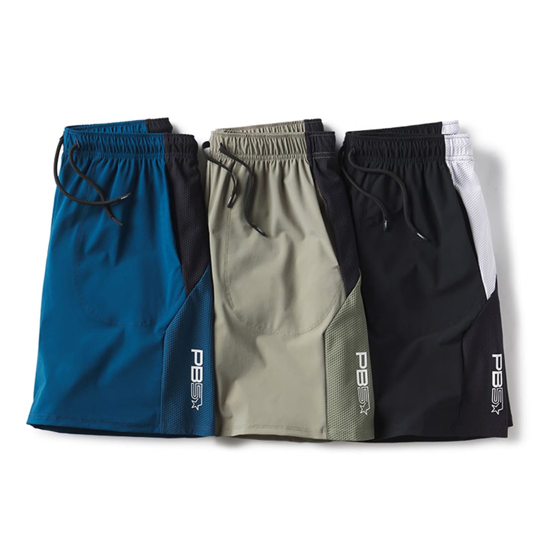 PB5star men's Vented Court shorts in astral blue, pavement, and black, featuring breathable fabric and adjustable drawstrings for comfort.