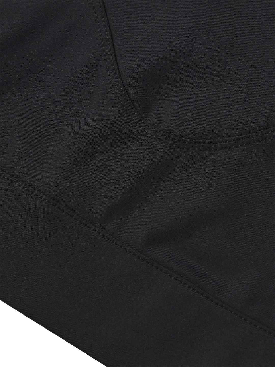 Close-up of the high-quality craftsmanship on the PB5star Racer Back Sports Bra in black, highlighting the precision stitching and smooth fabric that ensures durability and comfort. Ideal for pickleball enthusiasts seeking a sports bra that offers both sleek design and functional support for all levels of play.