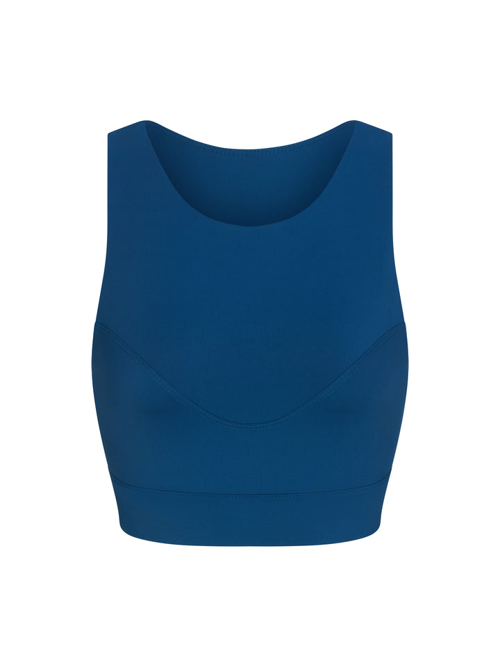 Racer Back Sports Bra with a high neck line, front view in astral blue.