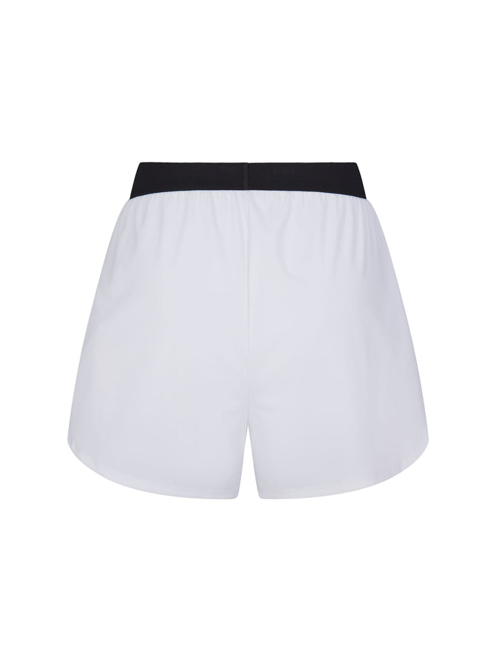 Rear view of PB5star Signature Court Shorts in white with a contrasting black waistband, combining fashion with functionality for athletes.