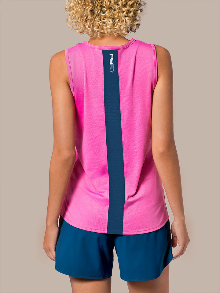 Rear view of model wearing PB5star women's Vented Tank in a pink with a central astral blue stripe, paired with coordinating Signature Court Shorts. This tank top boasts a sleek PB5star logo, a comfortable fit for ease of movement, and a moisture-wicking fabric ideal for pickleball enthusiasts looking to combine style and functionality on the court.